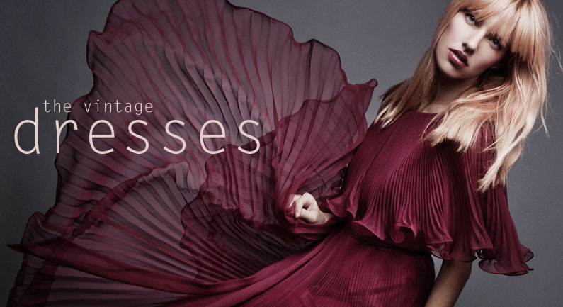 vintage dresses at The Rabbit Hole Miami clothing store, blonde fashion model with bangs in flowing vintage sheer pleated ruffled burgundy dress